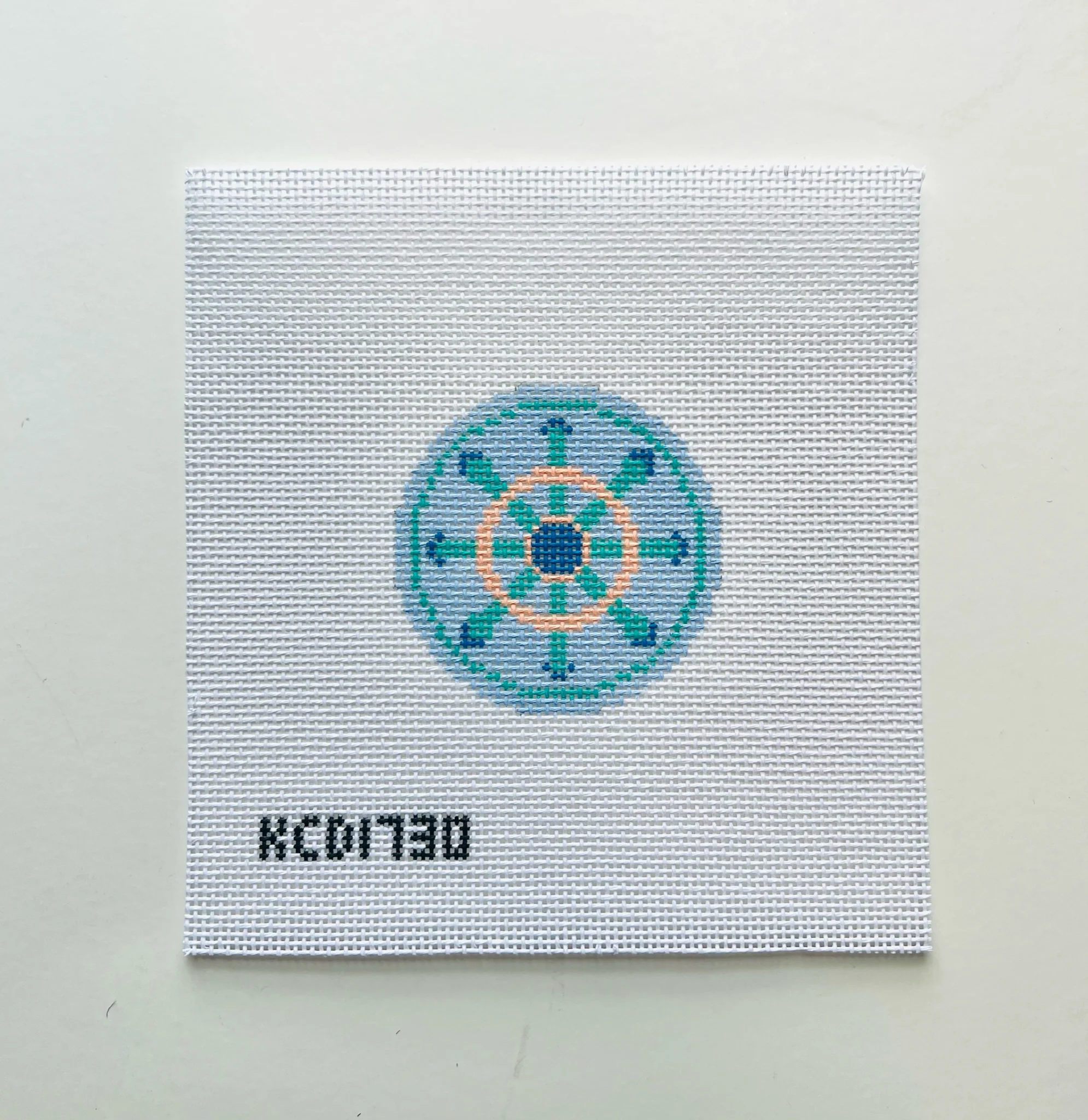 Green and Peach Wheel on Blue Canvas