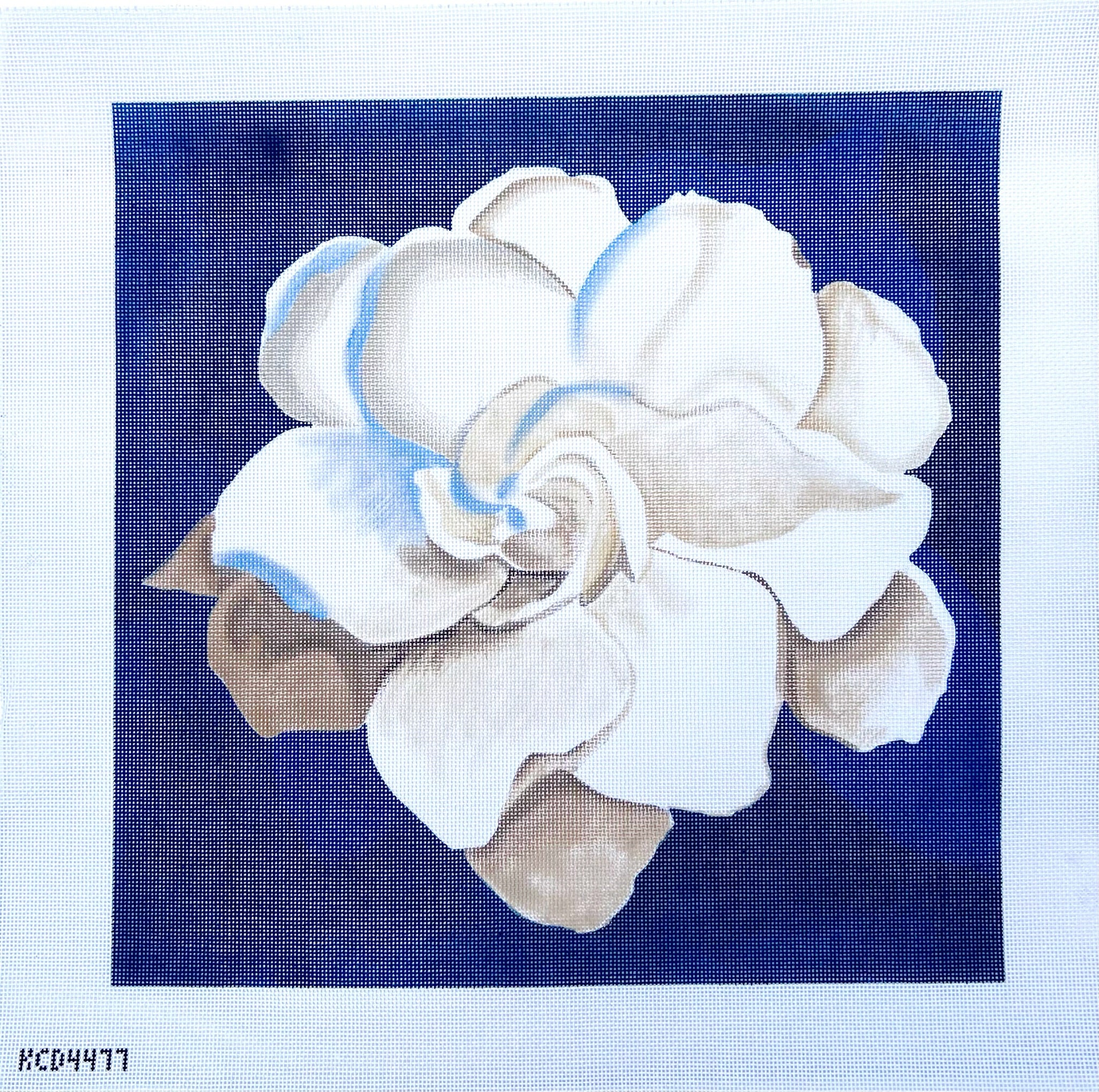 White Flower on Blue Pillow